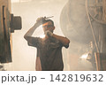 Dusty air pollution workplace, Danger Industrial manufacturing. Workers inhaling dust and fumes in factories bad lung health and risk of lung cancer. 142819632