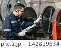 Professional Engineer Worker Schedule Inspecting Machine condition for safety in Heavy Industry Machinery Factory 142819634