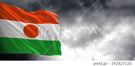 Niger Flag Waving Against Dark Cloudy Sky 142823120