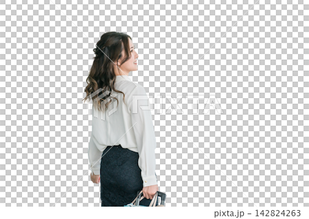 The back view of a businesswoman walking with a suitcase. The back view of a businesswoman walking with a suitcase. 142824263