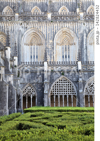 Gothic architecture and manicured gardens at Batalha Monastery in Portugal Gothic architecture and manicured gardens at Batalha Monastery in Portugal 142824432