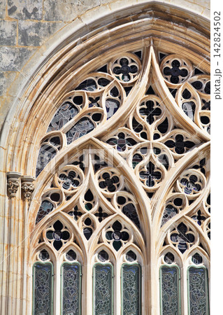 Intricate gothic window design at Batalha Monastery in Portugal Intricate gothic window design at Batalha Monastery in Portugal 142824502