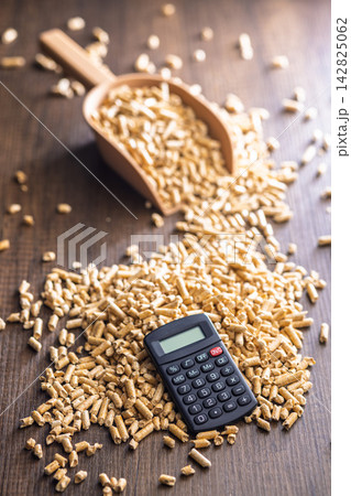 Wood Pellet Fuel Scoop With Calculator for Energy Cost Calculation and Biomass Heating Budgeting Wood Pellet Fuel Scoop With Calculator for Energy Cost Calculation and Biomass Heating Budgeting 142825062