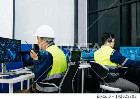 Asian male engineer in a hard hat Asian male engineer in a hard hat 142825283