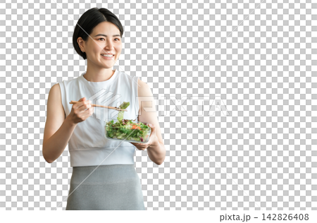 A young woman in sportswear eating a diet menu A young woman in sportswear eating a diet menu 142826408