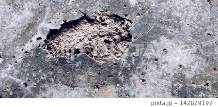 Damaged and Crumbling Concrete Wall Texture 142829197