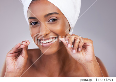 Floss, portrait and woman in studio for dental care, gum health and fresh breath with pride. female model, plaque remove and product for wellness, oral hygiene and teeth whitening by gray background Floss, portrait and woman in studio for dental care, gum health and fresh breath with pride. female model, plaque remove and product for wellness, oral hygiene and teeth whitening by gray background 142831294