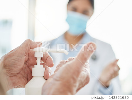 Hands, hospital and cleaning for germs or healthcare, hygiene and safety protocol for diseases or viruses. Senior person, female doctor and sanitiser for disinfection, sterilization and risk. Hands, hospital and cleaning for germs or healthcare, hygiene and safety protocol for diseases or viruses. Senior person, female doctor and sanitiser for disinfection, sterilization and risk. 142831680