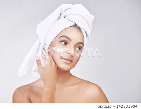Woman, skincare and relax with cream or ointment in hygiene or beauty on a gray studio background. Face of calm female person or model in relaxation for lotion, anti aging or healthy facial treatment Woman, skincare and relax with cream or ointment in hygiene or beauty on a gray studio background. Face of calm female person or model in relaxation for lotion, anti aging or healthy facial treatment 142831904