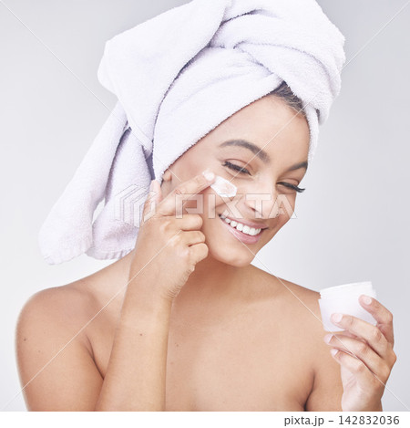 Happy woman, skincare and container with lotion or cream for hygiene or beauty on a gray studio background. Face of female person or model with smile for ointment, anti aging or facial treatment Happy woman, skincare and container with lotion or cream for hygiene or beauty on a gray studio background. Face of female person or model with smile for ointment, anti aging or facial treatment 142832036