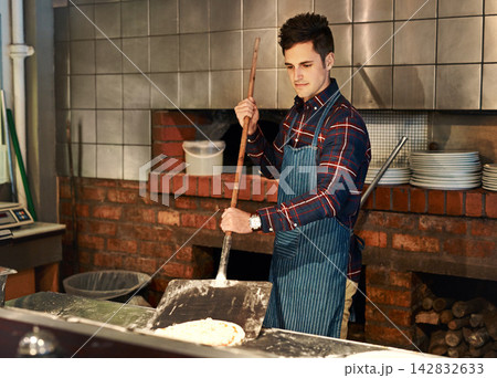 Restaurant, cooking and man in pizza kitchen for fast food, delicious meal or hospitality service. Entrepreneur, small business and chef with apron for take away, nutrition lunch or franchise store Restaurant, cooking and man in pizza kitchen for fast food, delicious meal or hospitality service. Entrepreneur, small business and chef with apron for take away, nutrition lunch or franchise store 142832633