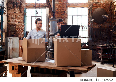Laptop, boxes or men in workshop for delivery, order or manufacturing trade in small business. Blacksmith, ecommerce or metal workers in warehouse on technology for production, stock or steel package Laptop, boxes or men in workshop for delivery, order or manufacturing trade in small business. Blacksmith, ecommerce or metal workers in warehouse on technology for production, stock or steel package 142832902