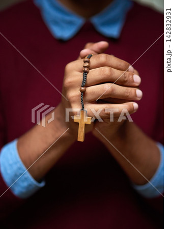 Person, hands and rosary beads for Christian prayer or God worship for Jesus trust, faith or religious. Cross, jewellery and church praise for mercy support or heaven help for healing, guide or hope 142832931