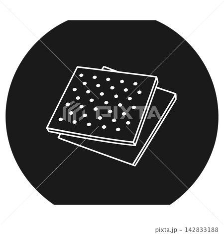 Stack of brown polka dot notepads on black background 142833188
