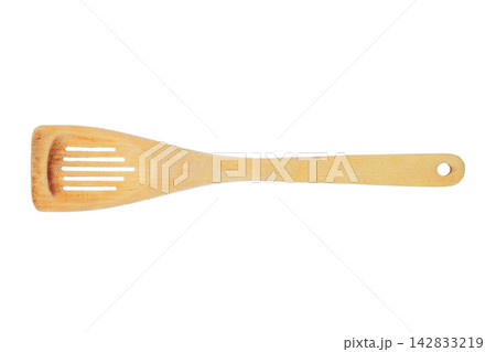 Wooden kitchen spatula isolated on a white background. Frequently used kitchen utensil. Kitchen gadget. Top view. 142833219