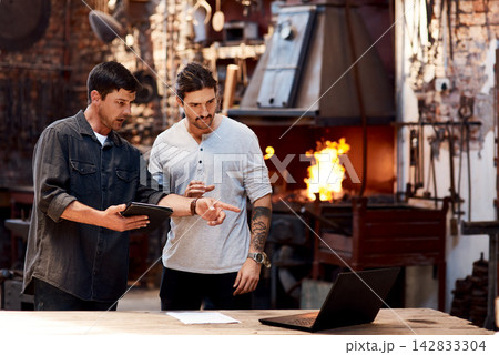 Tablet, laptop or people in workshop for blacksmith planning, labor or warehouse trade in small business. Teamwork, research or metal workers in factory on technology for production or steel industry Tablet, laptop or people in workshop for blacksmith planning, labor or warehouse trade in small business. Teamwork, research or metal workers in factory on technology for production or steel industry 142833304