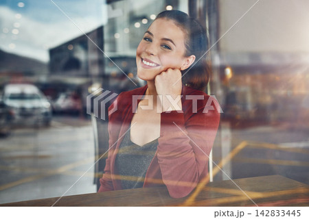 Woman, coffee shop or portrait with window, happy customer and pride with smile, joy and table. Girl, restaurant and university student with college break, cafe and glass in store with confidence 142833445