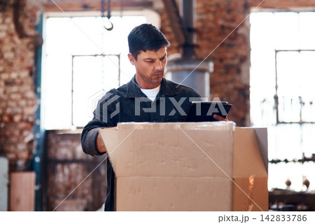 Tablet, cargo and man in workshop for delivery, order or manufacturing trade in small business. Blacksmith, ecommerce and metal worker in warehouse on technology for production, box and steel package Tablet, cargo and man in workshop for delivery, order or manufacturing trade in small business. Blacksmith, ecommerce and metal worker in warehouse on technology for production, box and steel package 142833786