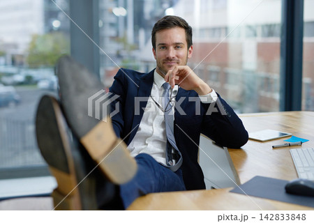 Businessman, feet up and portrait on break in office, workplace or company as advertising executive. Male person, professional and relax at desk in corporate, job and career as management or boss Businessman, feet up and portrait on break in office, workplace or company as advertising executive. Male person, professional and relax at desk in corporate, job and career as management or boss 142833848