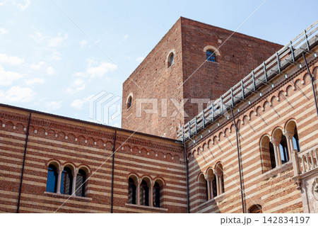 Palazzo della Ragione Facade with Brick Tower and Striped Stone Architecture in Verona Italy 142834197