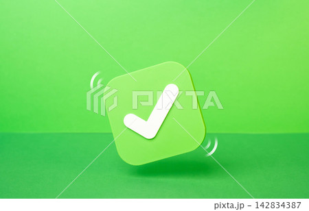 An approval checkmark on a green background. Democratic elections. Task completion and successful project finish. Trust, civic duty and participation. An approval checkmark on a green background. Democratic elections. Task completion and successful project finish. Trust, civic duty and participation. 142834387