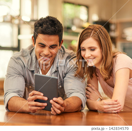 Couple, home and happy with tablet for budget, savings and investment plan or insurance. Table, smile and satisfied with relationship for house finance or loan and website with internet banking Couple, home and happy with tablet for budget, savings and investment plan or insurance. Table, smile and satisfied with relationship for house finance or loan and website with internet banking 142834570