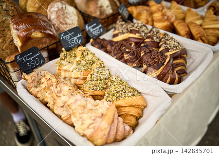 Fresh Croissants and Assorted Pastries Display at Bakery Market Fresh Croissants and Assorted Pastries Display at Bakery Market 142835701