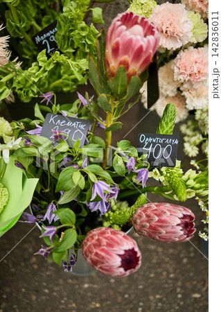 Flower Market Display with Pink Protea, Clematis and Price Tags Flower Market Display with Pink Protea, Clematis and Price Tags 142836011
