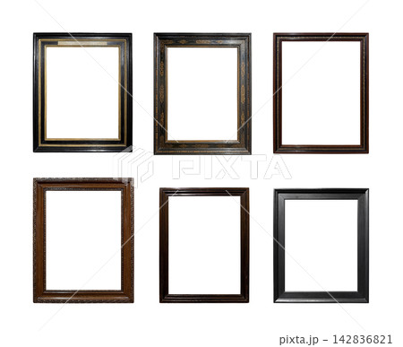 Collection of antique dark wooden picture frames isolated on white background Collection of antique dark wooden picture frames isolated on white background 142836821