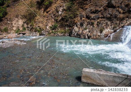 Scenery view of Langtang Khola river a river coming from the south flows down along the Langtang trekking route, Nepal. Scenery view of Langtang Khola river a river coming from the south flows down along the Langtang trekking route, Nepal. 142838233