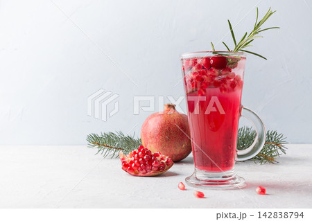 Pomegranate Christmas cocktail with rosemary, cranberry. Xmas drink. 142838794
