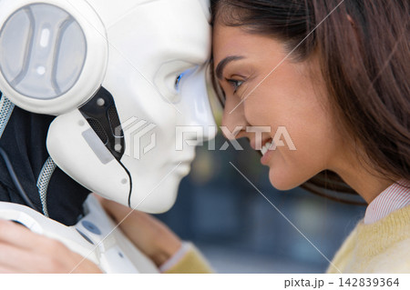Extreme close-up of smiling woman looking into eyes of robot 142839364