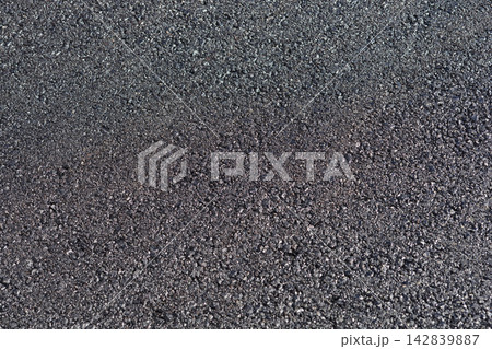 Rough asphalt pavement surface texture 142839887