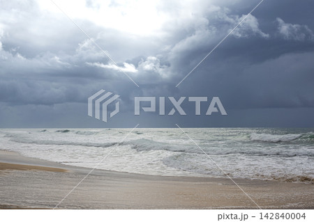 The beach is empty because the storm is coming. 142840004