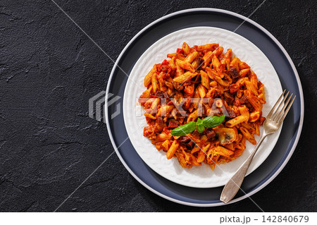 Penne rigate with smoked sausage cubes, sauce 142840679