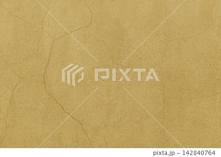 Stucco wall, yellow concrete texture background with cracks. Painted distressed plaster surface 142840764