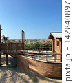 View of the beach. Bungalow umbrellas sun loungers recreation area. Sea and sand. 142840897