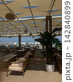 View of the beach. Bungalow umbrellas sun loungers recreation area. Sea and sand. 142840899