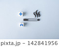 Smoking health risks and lung damage concept with cigarette and medical symbols 142841956