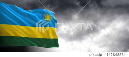 Rwanda Flag Waving Against Dark Cloudy Sky 142848284