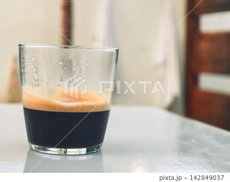 Glass of Black Coffee on Table With Copy Space 142849037