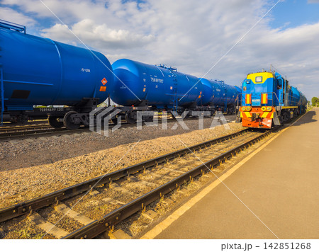 Blue Freight Train with Tank Cars on Tracks in Kyrgyzstan Blue Freight Train with Tank Cars on Tracks in Kyrgyzstan 142851268
