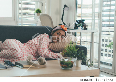 Woman enjoying life at home, promoting healthy eating, wellness, and a balanced lifestyle. Concept of natural nutrition, mindfulness, and modern healthy living. Woman enjoying life at home, promoting healthy eating, wellness, and a balanced lifestyle. Concept of natural nutrition, mindfulness, and modern healthy living. 142851728
