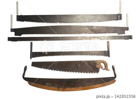 The image displays a collection of antique saws of various sizes. The image displays a collection of antique saws of various sizes. 142852356