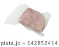A slice of pink ham is vacuum-sealed in clear plastic packaging. 142852414