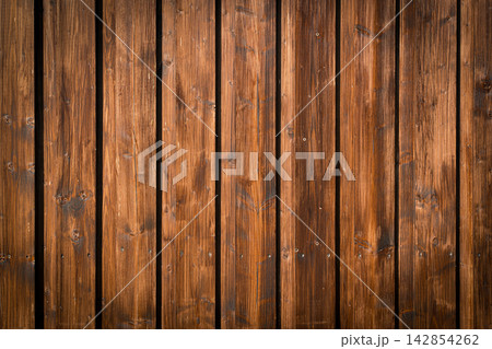 Natural wooden background of rustic brown boards, visible grain and organic texture Natural wooden background of rustic brown boards, visible grain and organic texture 142854262