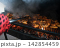 Delicious BBQ Chicken Wings Grilling Over Hot Coals in Backyard Delicious BBQ Chicken Wings Grilling Over Hot Coals in Backyard 142854459