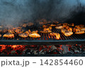 Delicious BBQ Chicken Wings Cooking on an Outdoor Charcoal Grill Delicious BBQ Chicken Wings Cooking on an Outdoor Charcoal Grill 142854460