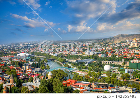 Tbilisi skyline aerial view. Kura river, Bridge of Peace and old town of Tbilisi cityscape, Georgia 142855495