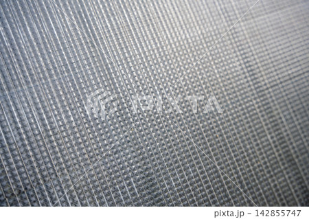 Close up texture of photovoltaic solar panel surface with silicon cells pattern. Renewable energy technology background 142855747